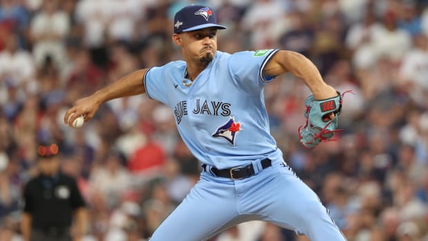 Toronto Blue Jays relief pitcher Jordan Hicks (12) pitches in the in the eighth inning of a game against the Minnesota Twins.